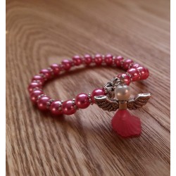 Dětský náramek z růžových skleněných perliček s andělíčkem
